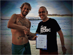 A happy day for Tom, a new PADI Instructor